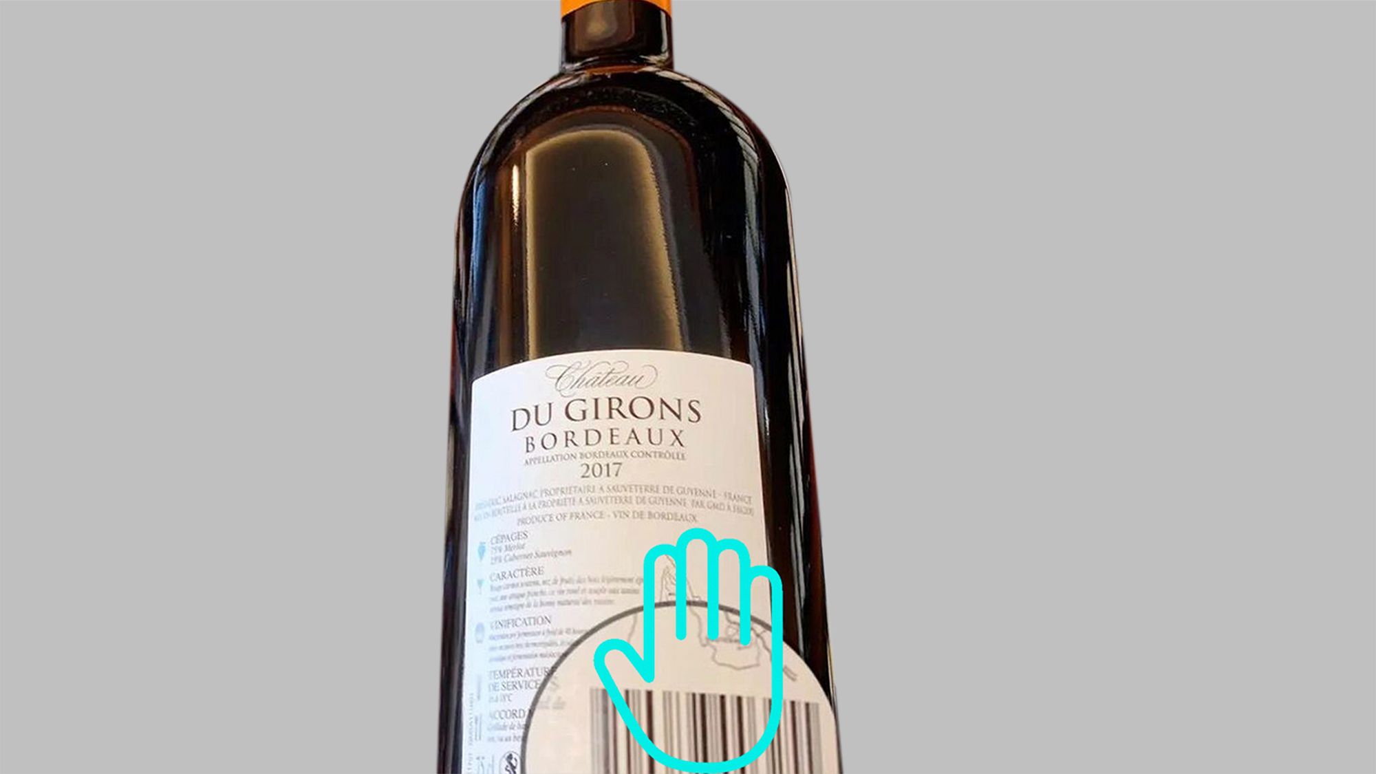Ai retail loss prevention: hand - blocked barcode on bordeaux wine bottle